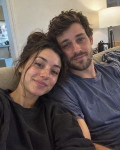 Example phone photo: a selfie of a couple on the sofa in their living room