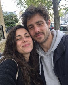 Example phone photo: a selfie of a couple on a city street