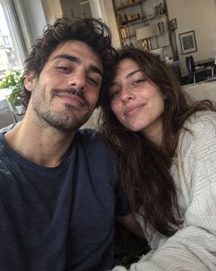 Example phone photo: a selfie of a couple at home by a window