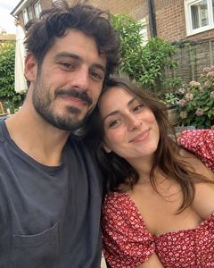 Example phone photo: a selfie of a couple in a back garden