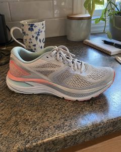 Example phone photo: a grey running shoe on a granite kitchen counter