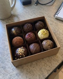 Example phone photo: a box of chocolate truffles on a kitchen counter